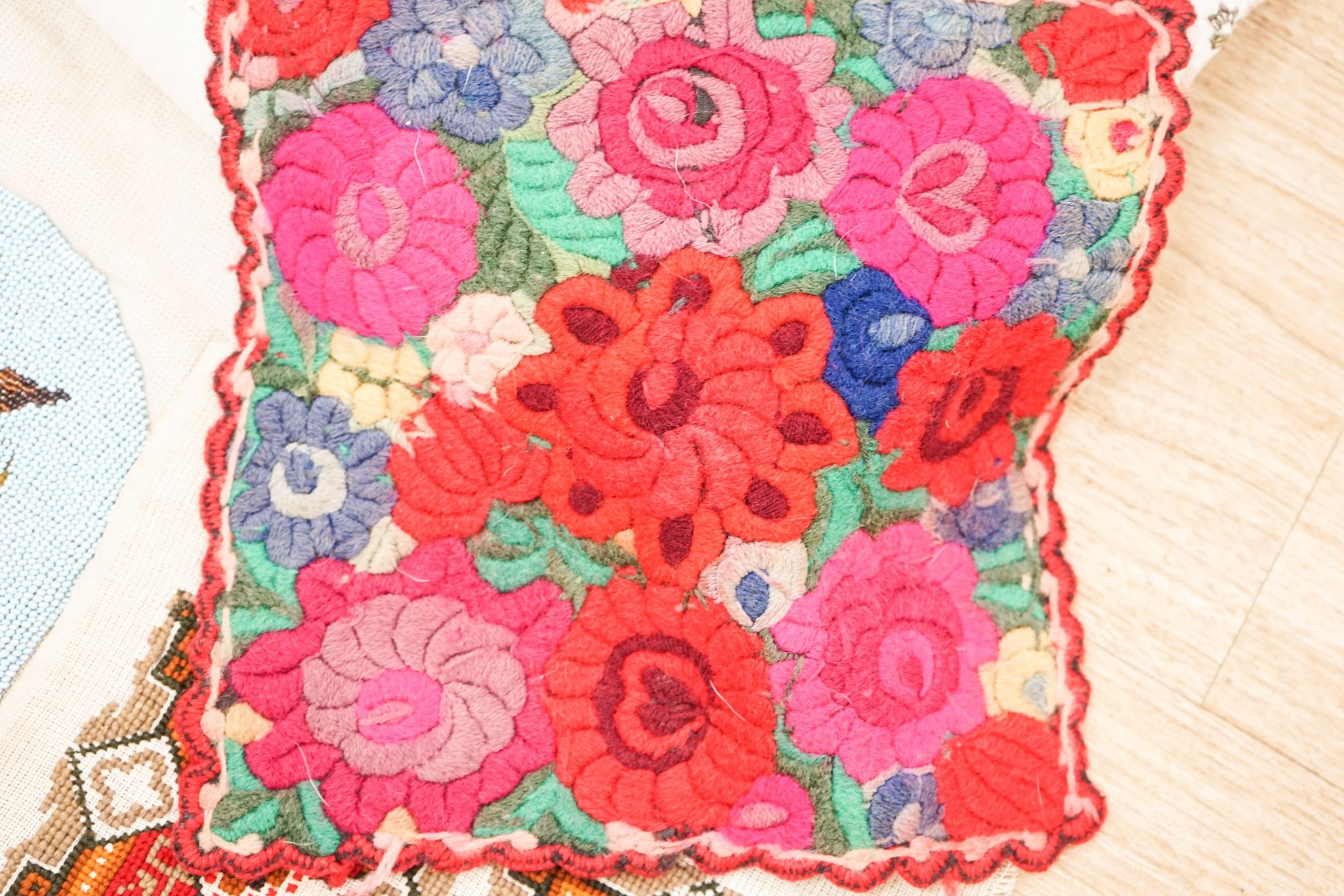 A Berlin beadwork tray panel, an Indian embroidered cloth etc.
